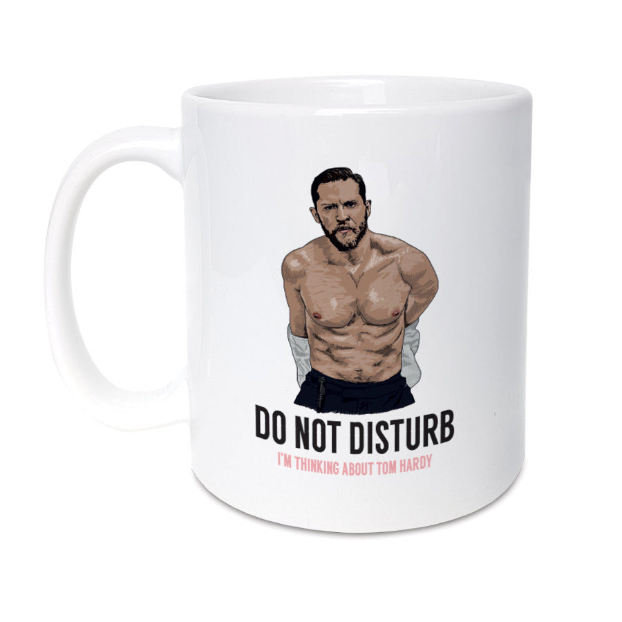 A unique mug featuring hand drawn illustration of Tom Hardy. Enjoy a cup of tea or coffee & sit back, relax & think about Tom Hardy. Mug reads: Do not disturb I'm thinking about Tom Hardy