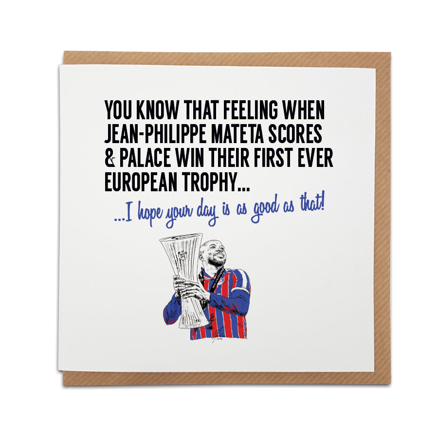 Square birthday greeting card resting on a brown kraft envelope. Bold black text reads "YOU KNOW THAT FEELING WHEN JEAN-PHILIPPE MATETA SCORES & PALACE WIN THEIR FIRST EVER EUROPEAN TROPHY..." followed by blue text reading "...I hope your day is as good as that!". Below is a hand-drawn illustration of Crystal Palace player Jean-Philippe Mateta holding the Europa Conference League trophy in his red and blue kit. Crystal Palace football birthday card designed by Local Lingo.