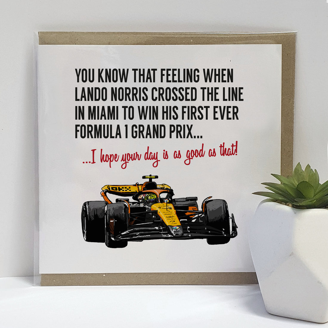 Formula 1 themed greeting card showcasing Lando Norris' race car as he wins his first Grand Prix in Miami. The card's text reads 'You know that feeling when Lando Norris crossed the line in Miami to win his first ever Formula 1 Grand Prix... I hope your day is as good as that!' Created by Local Lingo, the card captures the thrill of victory and is perfect for fans and enthusiasts of motorsport and Lando Norris