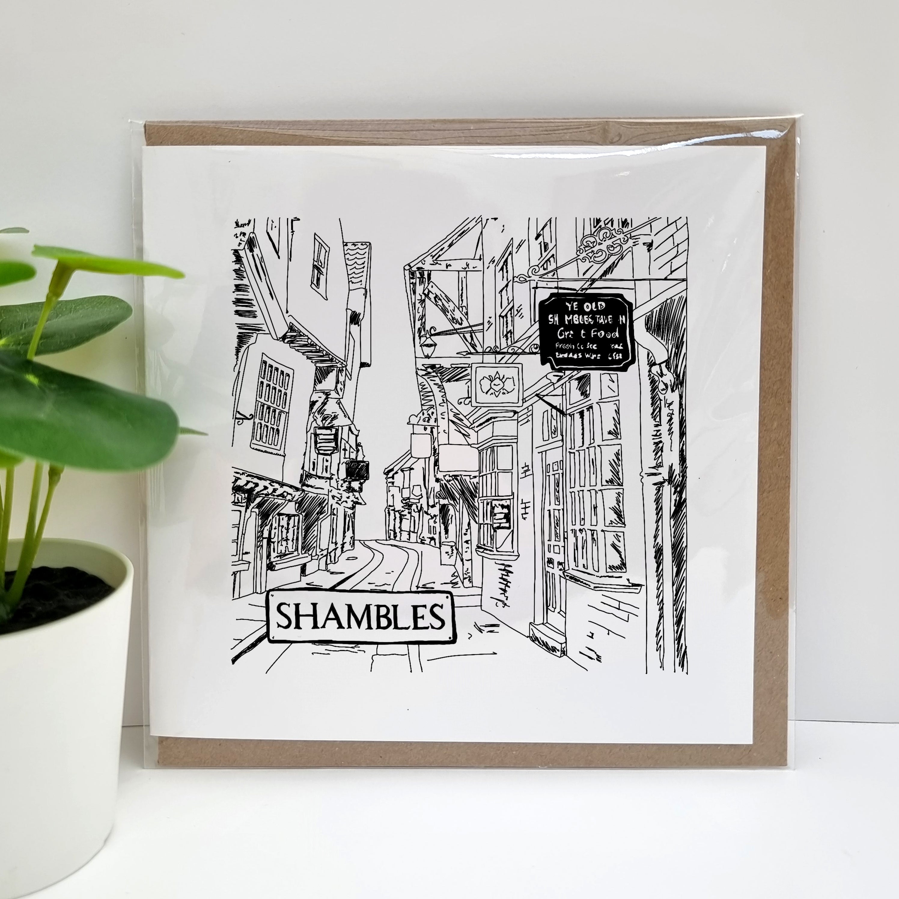 A unique handmade York themed greetings card, featuring a hand drawn illustration of The Shambles. Designed & printed in the UK by A Town Called Home.  This card can be used for a range of different occasions, to remind friends and loved ones of 'home' or to bring back special memories of trips to the picturesque city of York.  