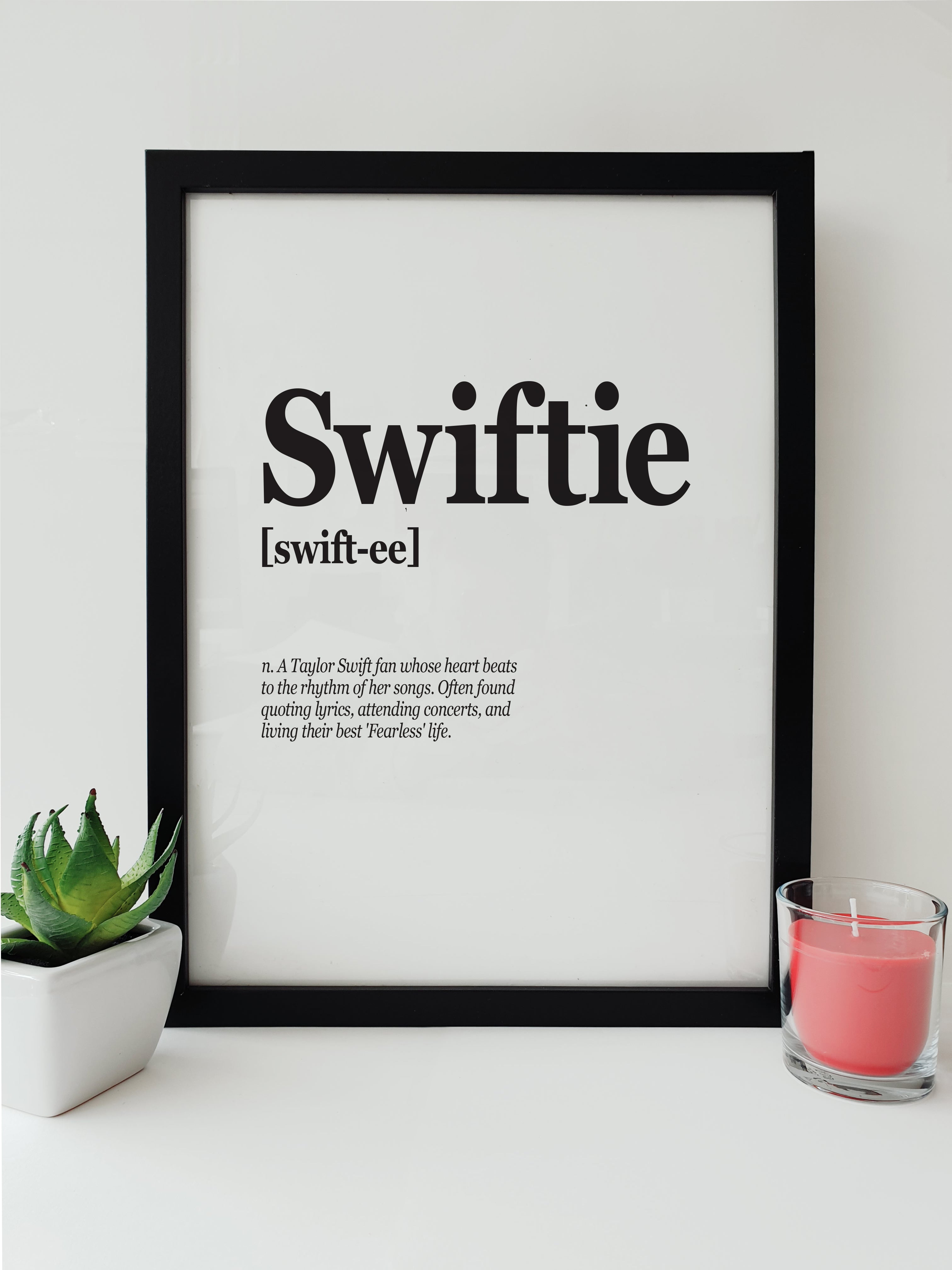 Swiftie Definition Taylor Swift Fan Artwork by Local Lingo, featuring the definition of 'Swiftie' with black text on a white background in a black frame.