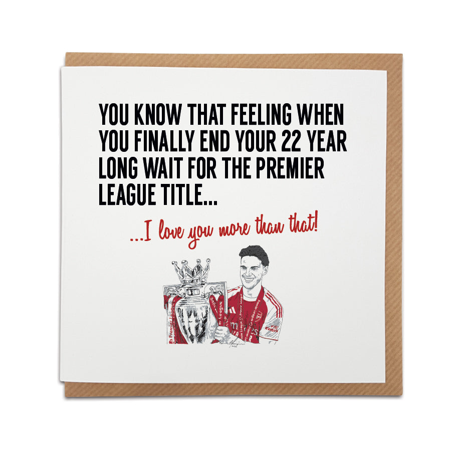 Square romantic greeting card resting on a brown kraft envelope. Bold black text reads "YOU KNOW THAT FEELING WHEN YOU FINALLY END YOUR 22 YEAR LONG WAIT FOR THE PREMIER LEAGUE TITLE..." followed by red text reading "...I love you more than that!". Below is a hand-drawn illustration of Arsenal player Declan Rice holding the Premier League trophy in his red and white kit. Arsenal football anniversary card designed by Local Lingo.