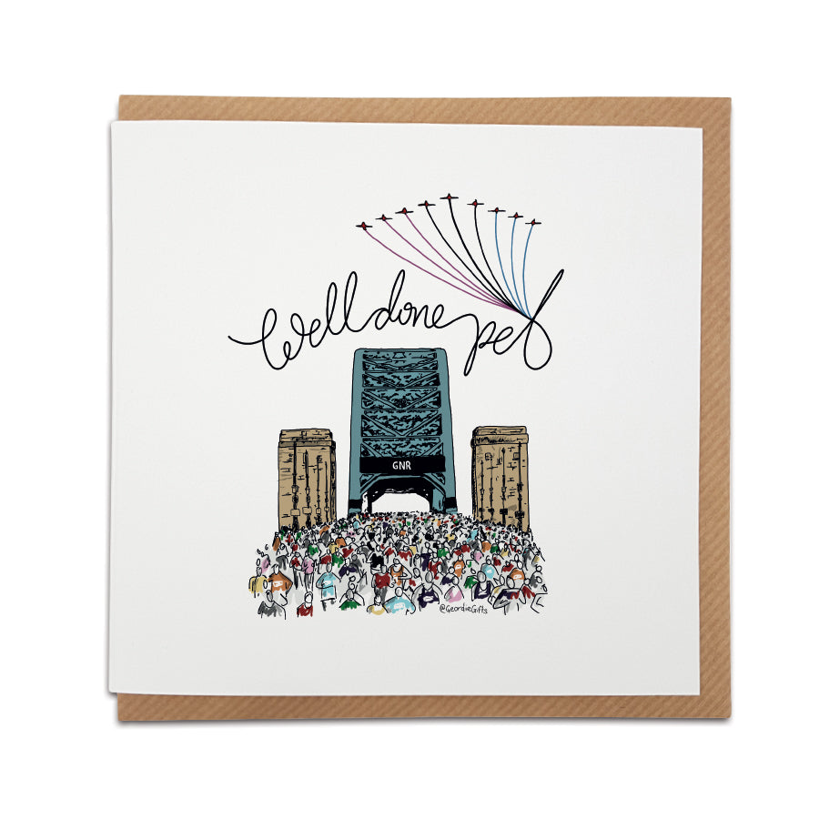 Square congratulations card resting on a brown kraft envelope. The design features a hand-drawn illustration of a massive crowd of runners crossing the Tyne Bridge in Newcastle. The Red Arrows fly overhead leaving red, white, and blue trails. Above the bridge, elegant cursive text reads "Well done pet". Great North Run half marathon greeting card.
