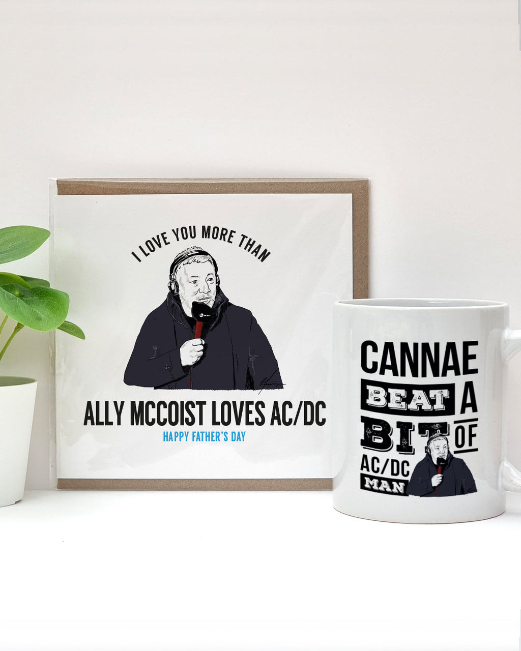 Father’s Day card and mug gift set featuring illustrations of Ally McCoist. The card reads “I love you more than Ally McCoist loves AC/DC – Happy Father’s Day” and the mug says “Cannae beat a bit of AC/DC man.” A humorous gift for football and music-loving dads designed by local lingo
