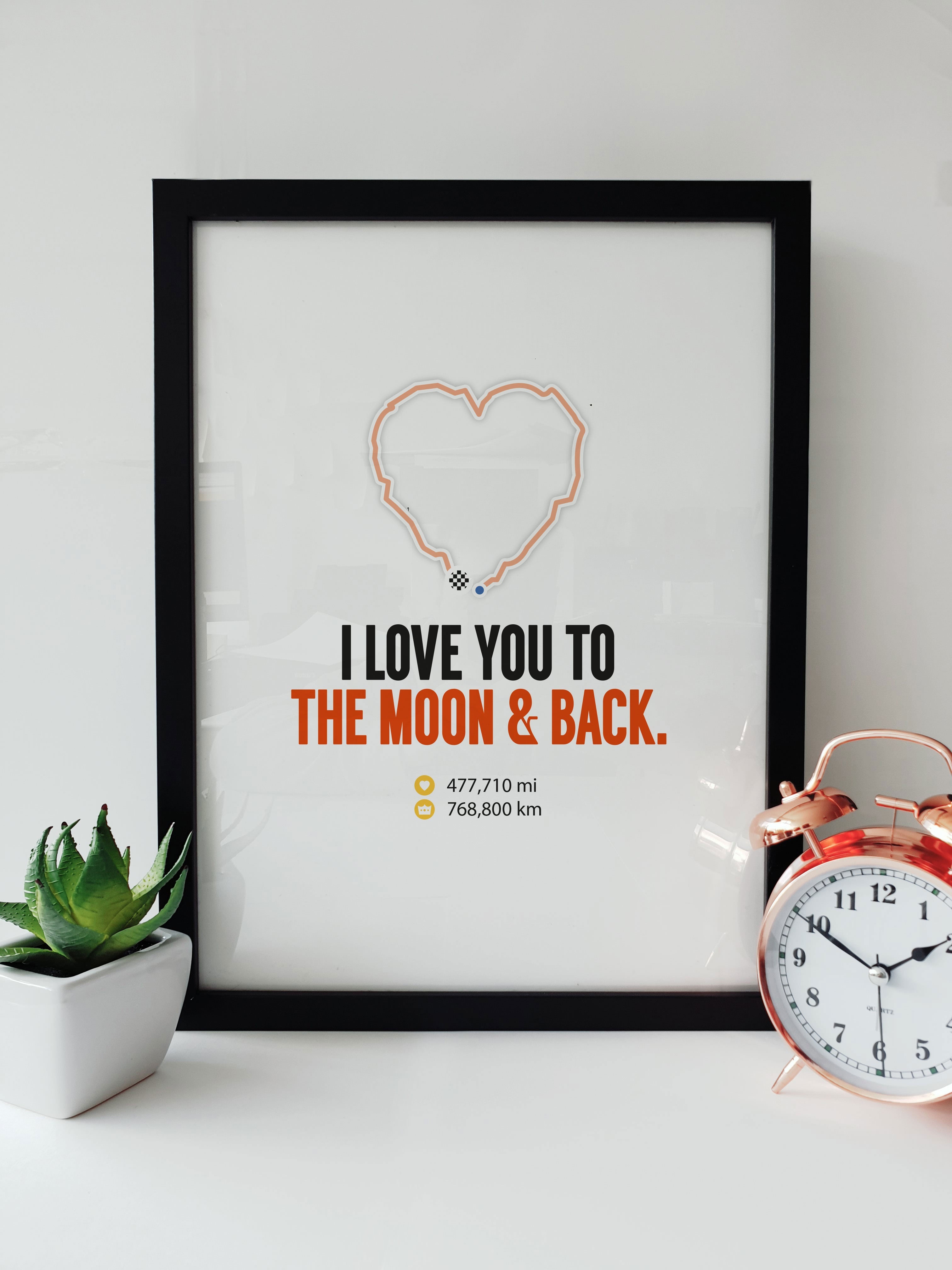 Strava-themed fitness print with a heart-shaped distance track, 'I love you to the moon & back', ideal for running and cycling enthusiasts from Local Lingo.