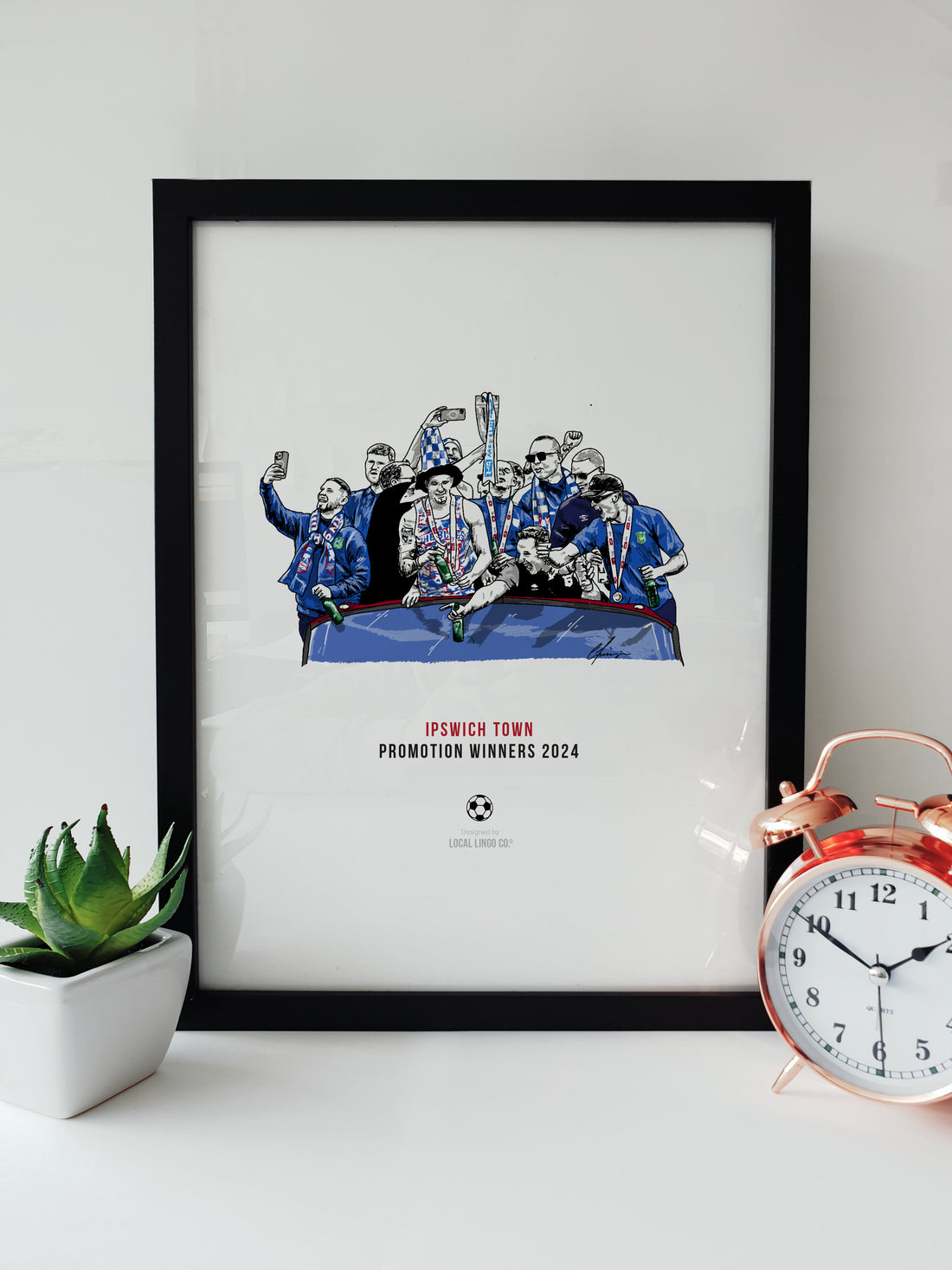 Art print of Ipswich Town Football Club's 2024 promotion celebration on a team bus, featuring players and staff jubilantly holding a trophy, designed by Local Lingo.