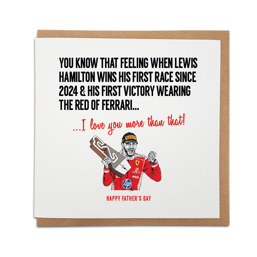 Square Father's Day greeting card resting on a brown kraft envelope. Bold black text reads "YOU KNOW THAT FEELING WHEN LEWIS HAMILTON WINS HIS FIRST RACE SINCE 2024 & HIS FIRST VICTORY WEARING THE RED OF FERRARI..." followed by red text reading "...I love you more than that!". Below is a hand-drawn illustration of F1 driver Lewis Hamilton celebrating with a trophy in his red Ferrari race suit, with "HAPPY FATHER'S DAY" printed at the very bottom in red. Lewis Hamilton Formula 1 Father's Day card designed by