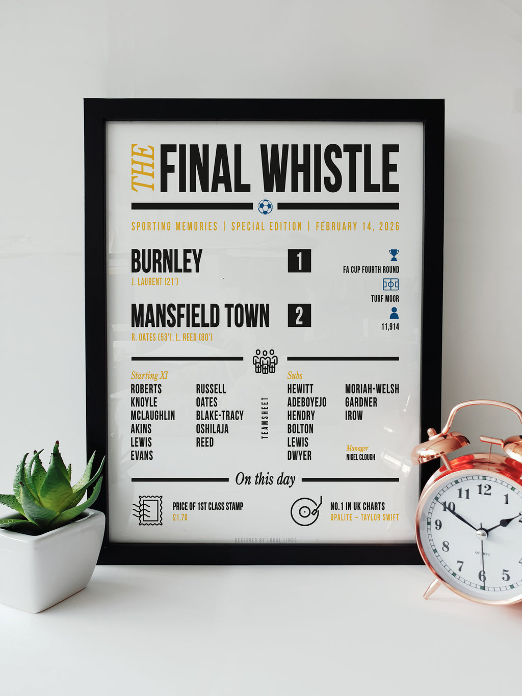 Framed "The Final Whistle" stats print celebrating Mansfield Town's 2-1 FA Cup victory over Burnley on February 14, 2026. Features the scoreline, goalscorers R. Oates and L. Reed, starting XI, attendance of 11,914, and match trivia. Football match report art designed by Local Lingo.