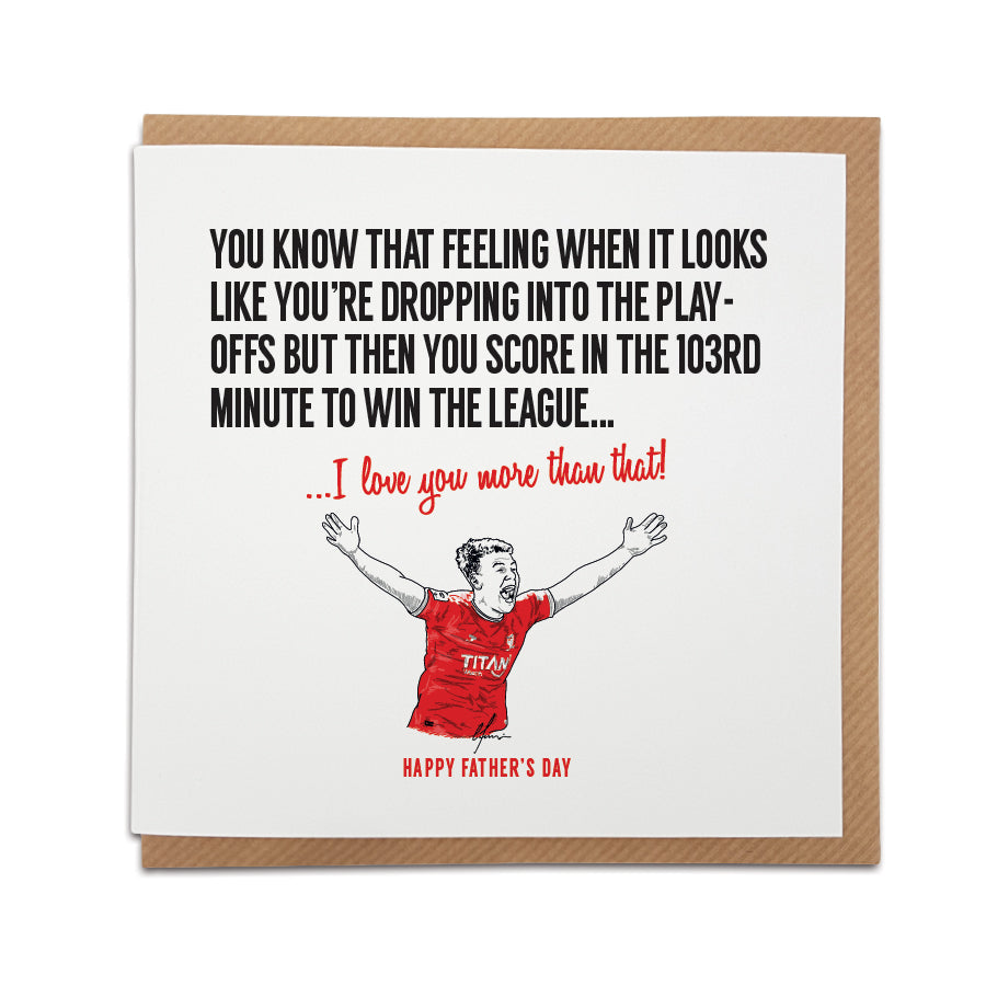 Square Father's Day greeting card resting on a brown kraft envelope. Bold black text reads: "You know that feeling when it looks like you're dropping into the play-offs but then you score in the 103rd minute to win the league...". Below it, red script reads "...I love you more than that!". A second line of red text at the bottom reads "HAPPY FATHER'S DAY". Features a hand-drawn illustration of a York City football player celebrating with arms raised in a red kit. Sentimental York City Father's Day football 