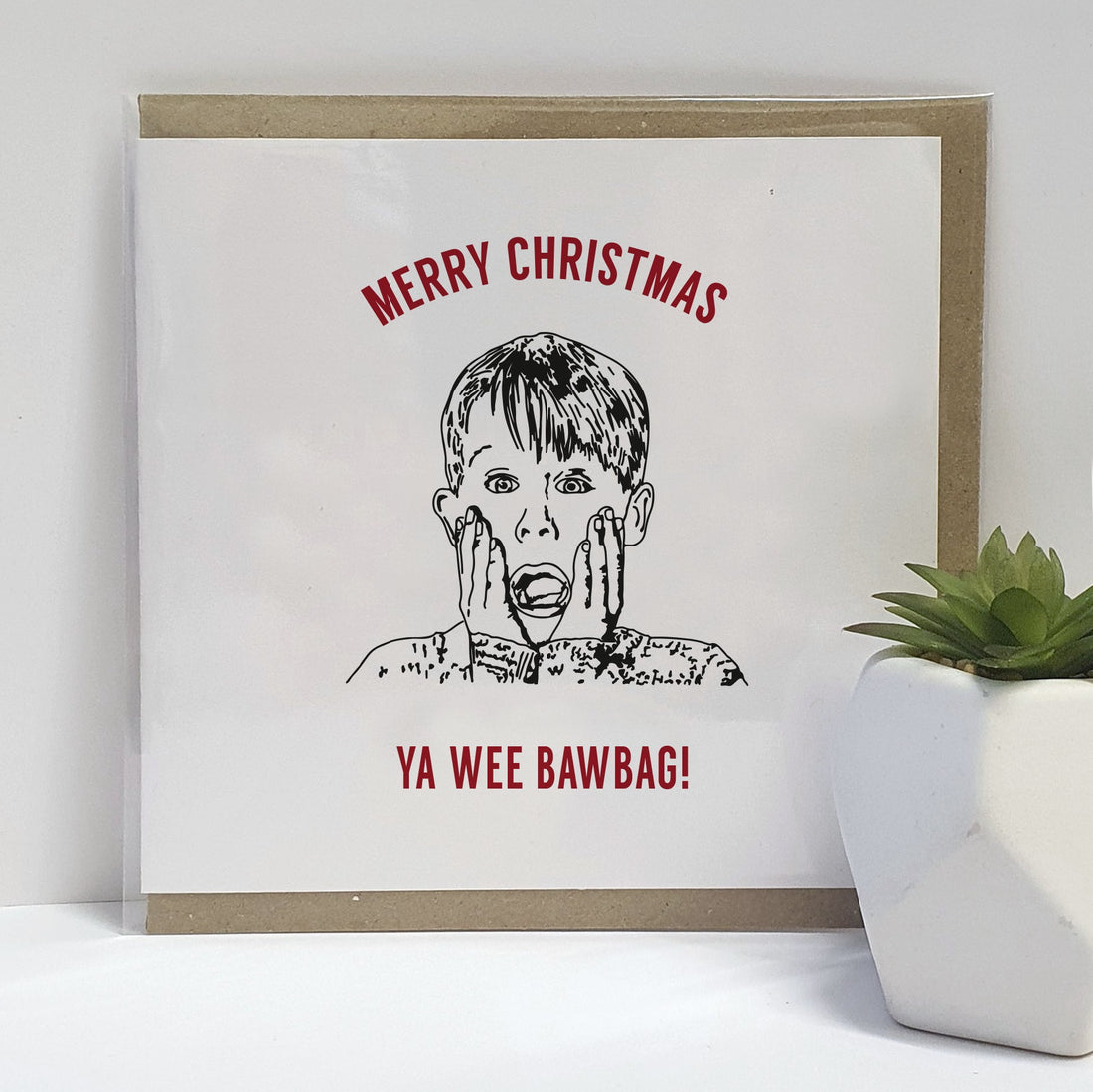 A Glasweigan twist on a Home Alone movie themed Christmas Card. A unique card, perfect for those fans of this iconic film (who happen to be from Glasgow).  Card reads: Merry Christmas Ya Little BawBag (illustration of Kevin McCallister)