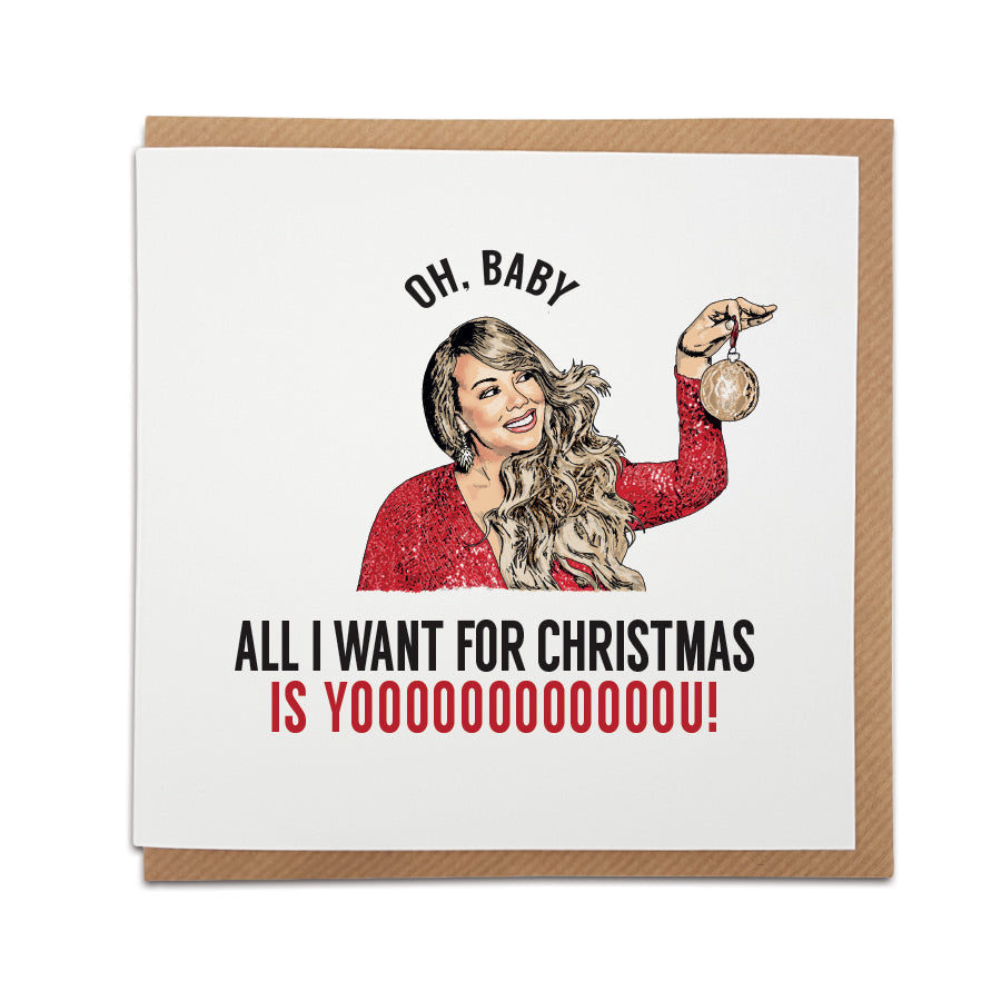 A handmade Christmas Card inspired by popular Mariah Carey song, designed by A Town Called Home.  Featuring hand drawn illustration of Mariah Carey.  Greetings card is printed on high quality card stock.  Card reads:   Oh, Baby  All I want for Christmas is Yoooooooooooou!