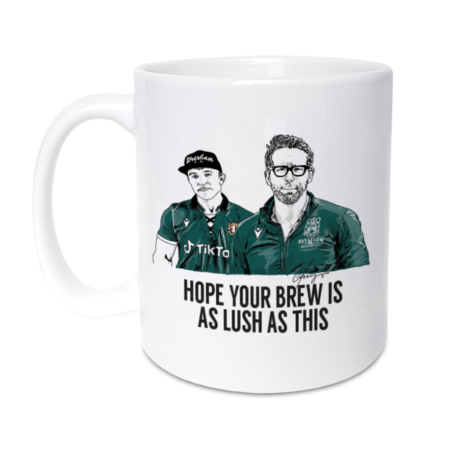A handmade Wrexham football themed mug. The perfect gift for Red Dragons supporters.   (Featuring an illustration of Deadpool's Ryan Reynolds and It's always sunny in philadelphia actor Rob McElhenney).   11oz Mug reads: I hope your cuppa is as lush as this